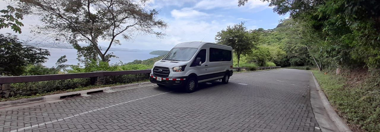 Image of a van with the sea in the background